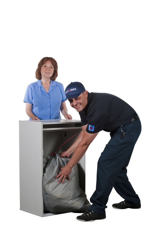 Corodata employee handling a corodata console